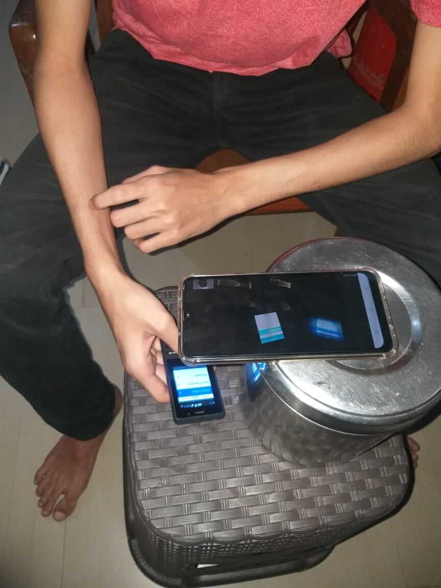 A participant is using an android device to screen share on a zoom call.