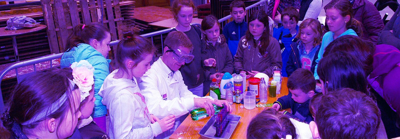 Scientist demonstrates experiments at a science fair